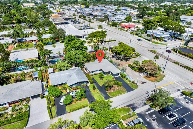 an aerial view of residential houses with outdoor space