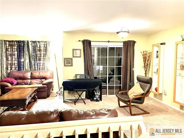 a building outdoor space with patio furniture and potted plants