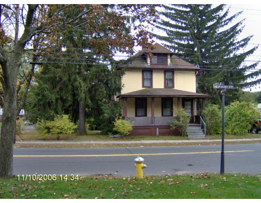 666 Newbury Street Springfield, MA 01104 - Photo 2 of 2 a front view of a house with a yard