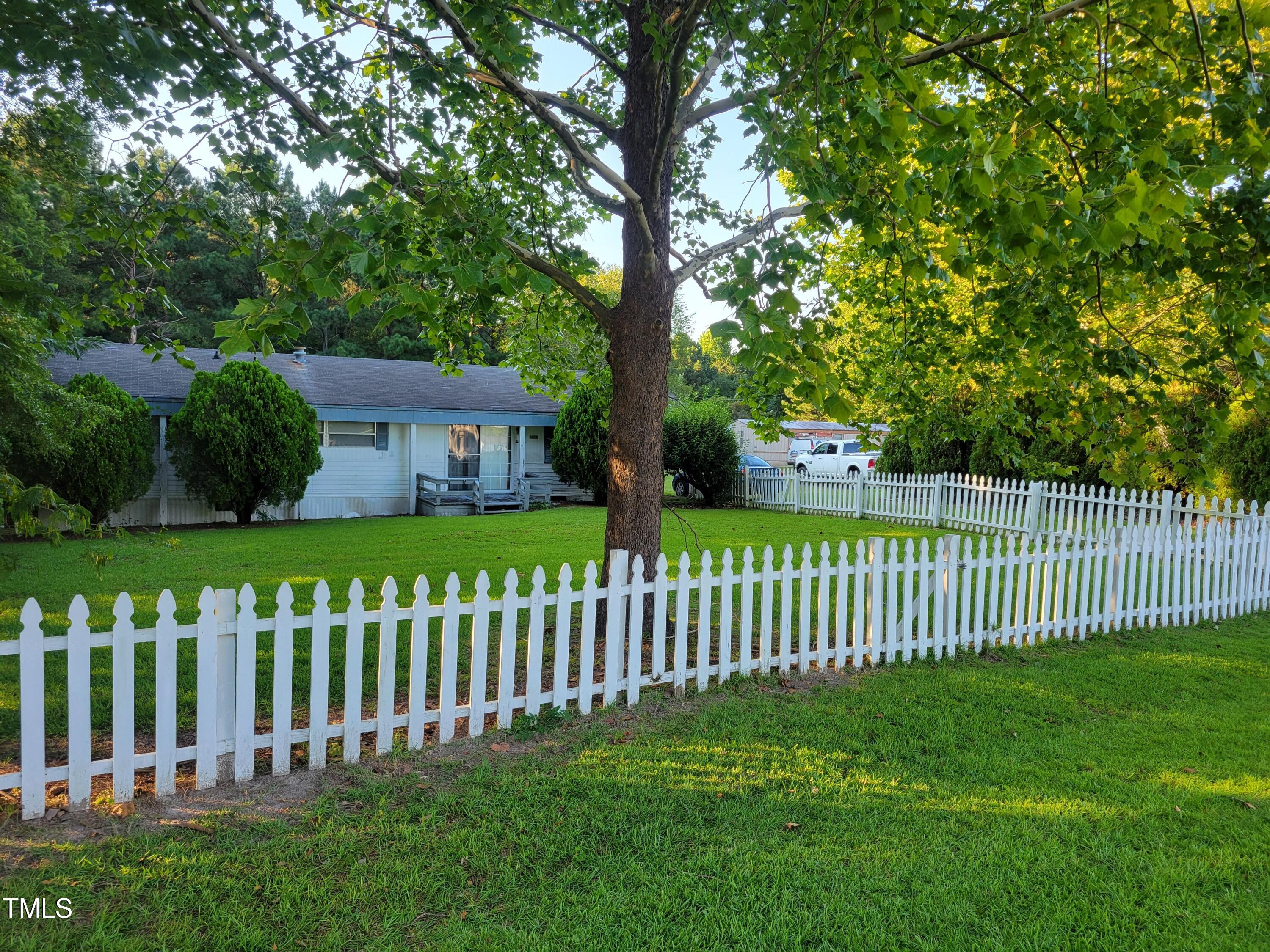 4044 Chris Cole Road Sanford, NC 27332 - Photo 5 of 16 a view of a wooden fence