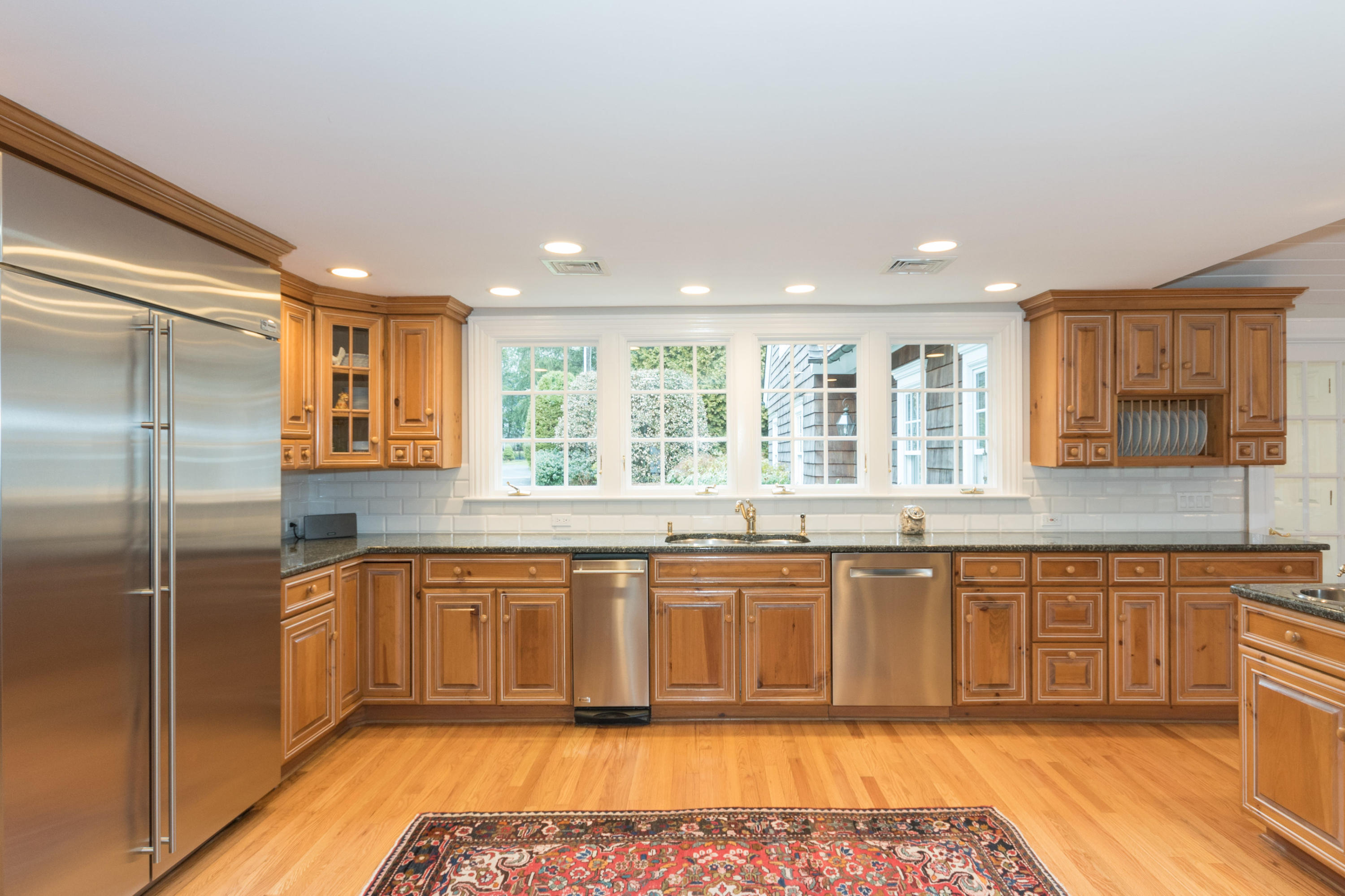 783 Valley Road New Canaan, CT 06840 - Photo 14 of 28 a large kitchen with granite countertop lots of counter space and a sink