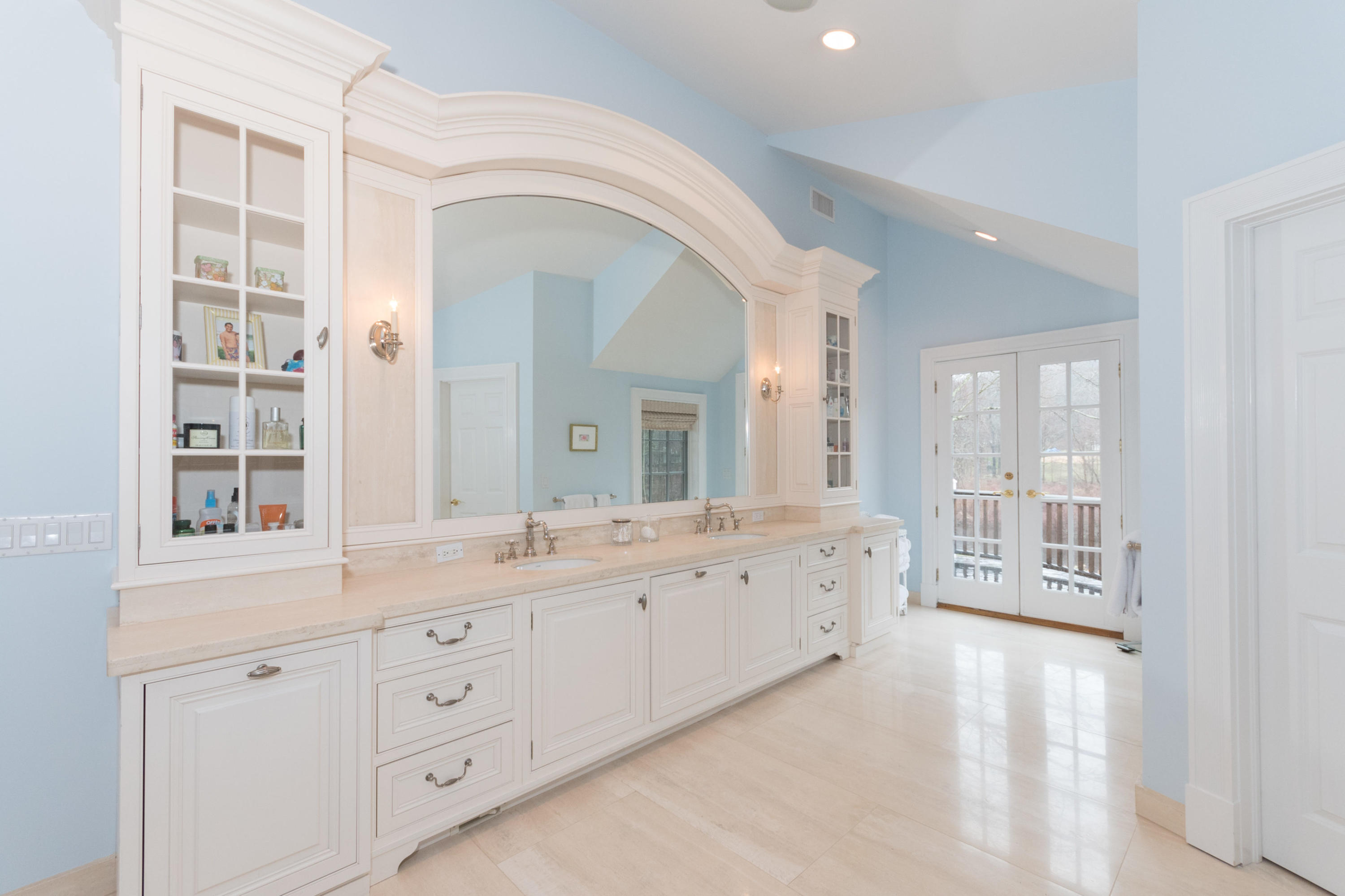 783 Valley Road New Canaan, CT 06840 - Photo 17 of 28 a spacious bathroom with a granite countertop sink mirror and