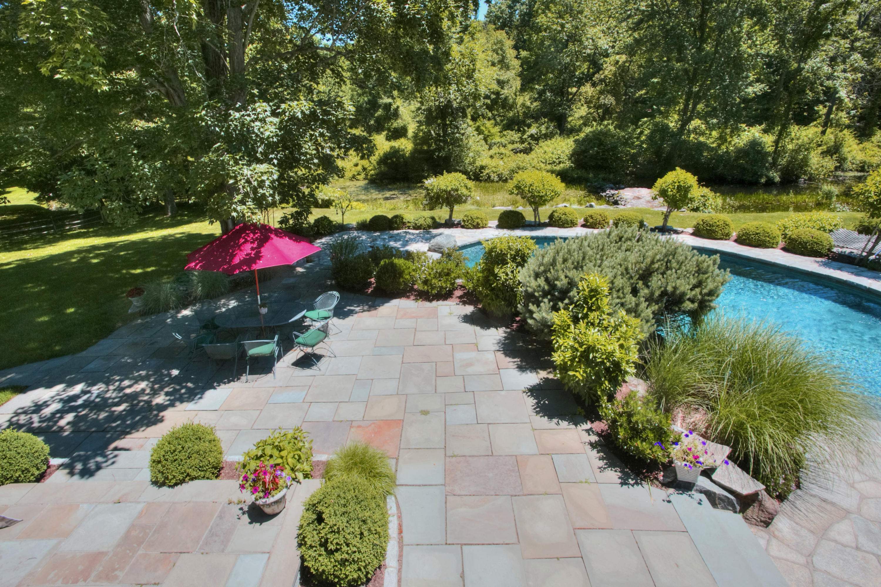 783 Valley Road New Canaan, CT 06840 - Photo 4 of 28 a view of a house with a yard and garden