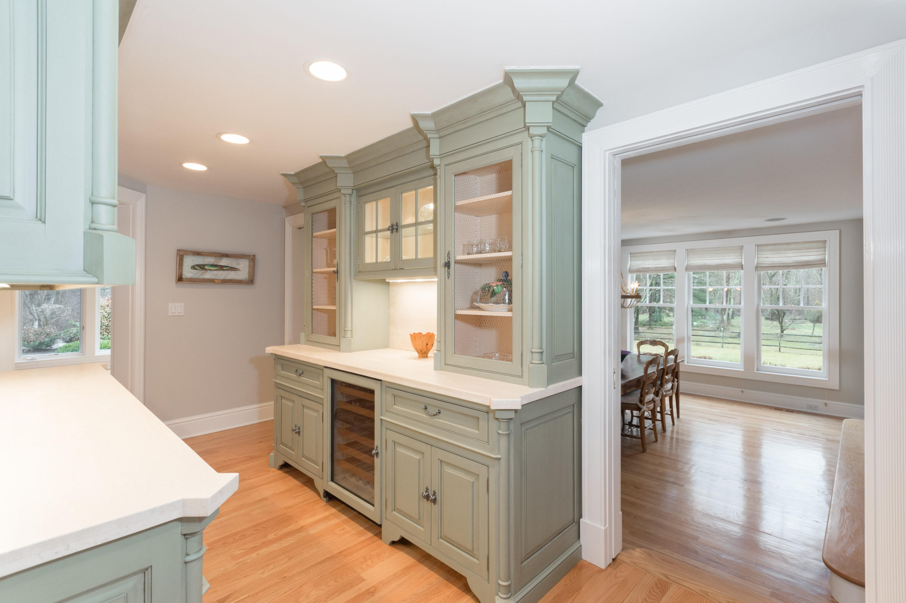 783 Valley Road New Canaan, CT 06840 - Photo 8 of 28 a kitchen with stainless steel appliances granite countertop a stove and a large window
