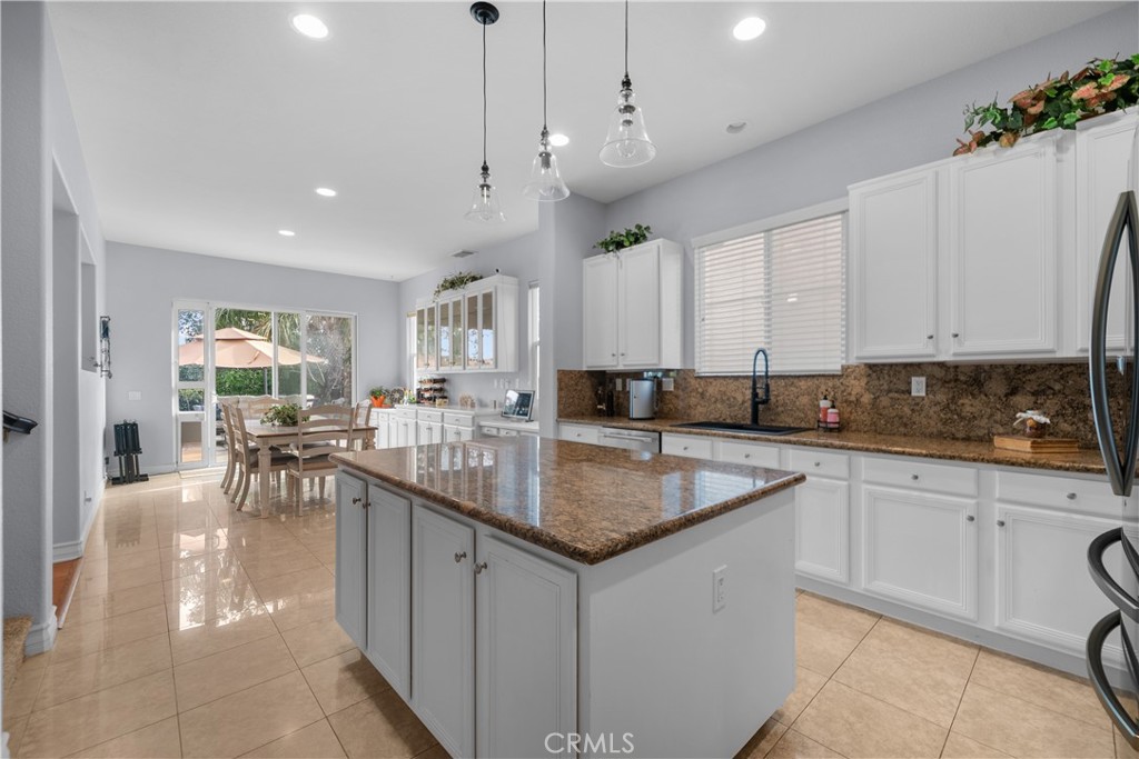 29350 Las Brisas Road Valencia, CA 91354 - Photo 13 of 75 a kitchen with stainless steel appliances granite countertop a sink a stove counter space and cabinets