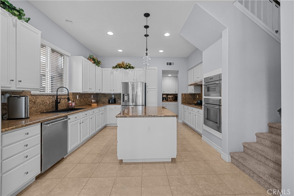 29350 Las Brisas Road Valencia, CA 91354 - Photo 14 of 75 a large kitchen with stainless steel appliances granite countertop a large counter top and a stove