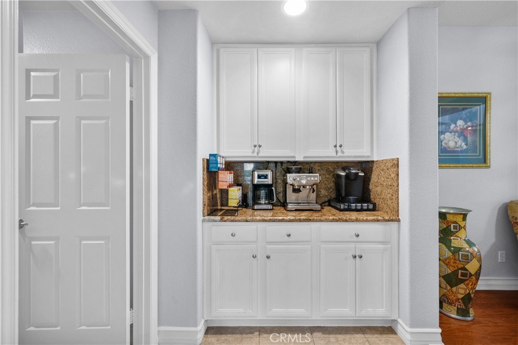 29350 Las Brisas Road Valencia, CA 91354 - Photo 19 of 75 a room with white cabinets and clock on the wall