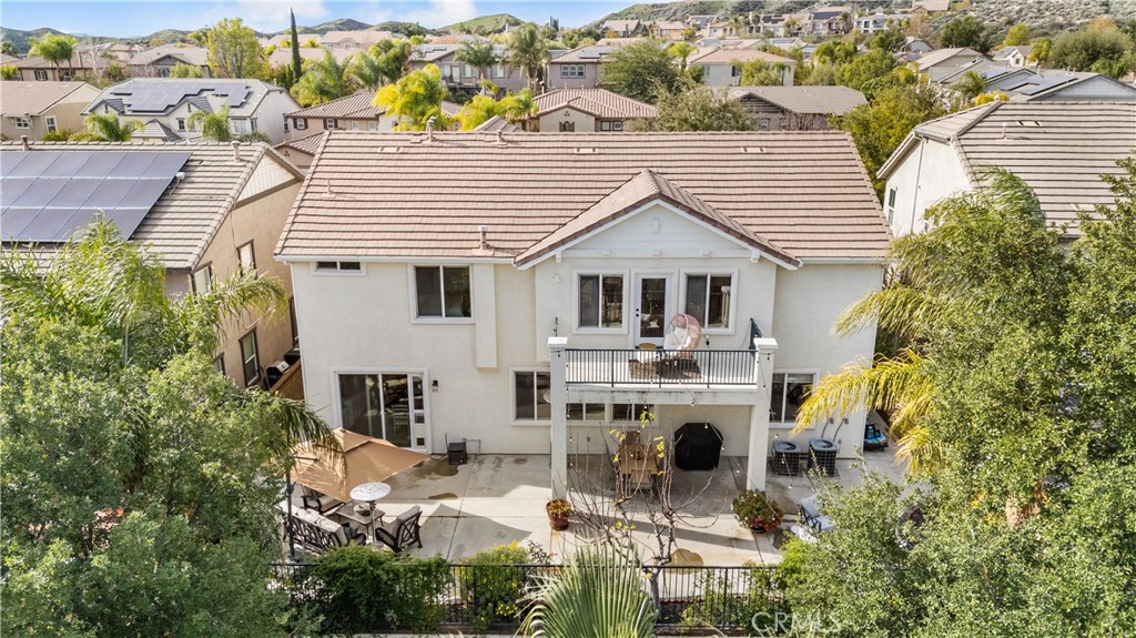 29350 Las Brisas Road Valencia, CA 91354 - Photo 2 of 75 a view of a white house with a chairs and table in kitchen