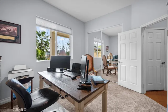 a bed room with a bed and a television