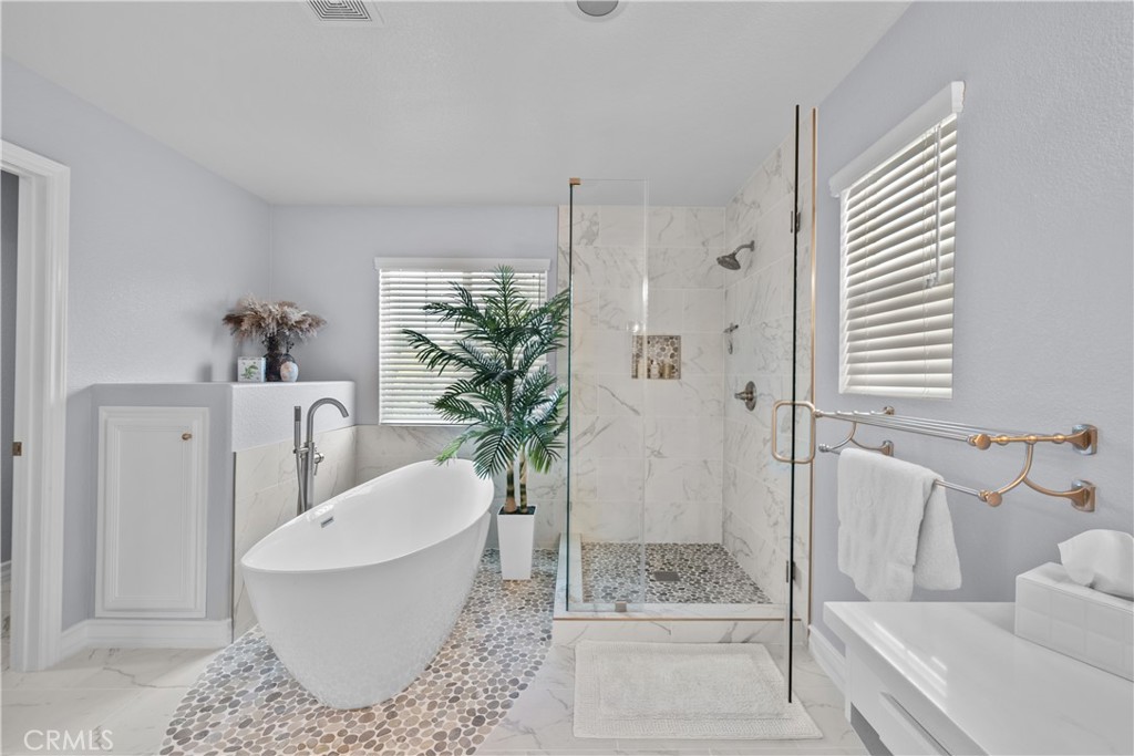 29350 Las Brisas Road Valencia, CA 91354 - Photo 29 of 75 a bath room with a bathtub and a shower