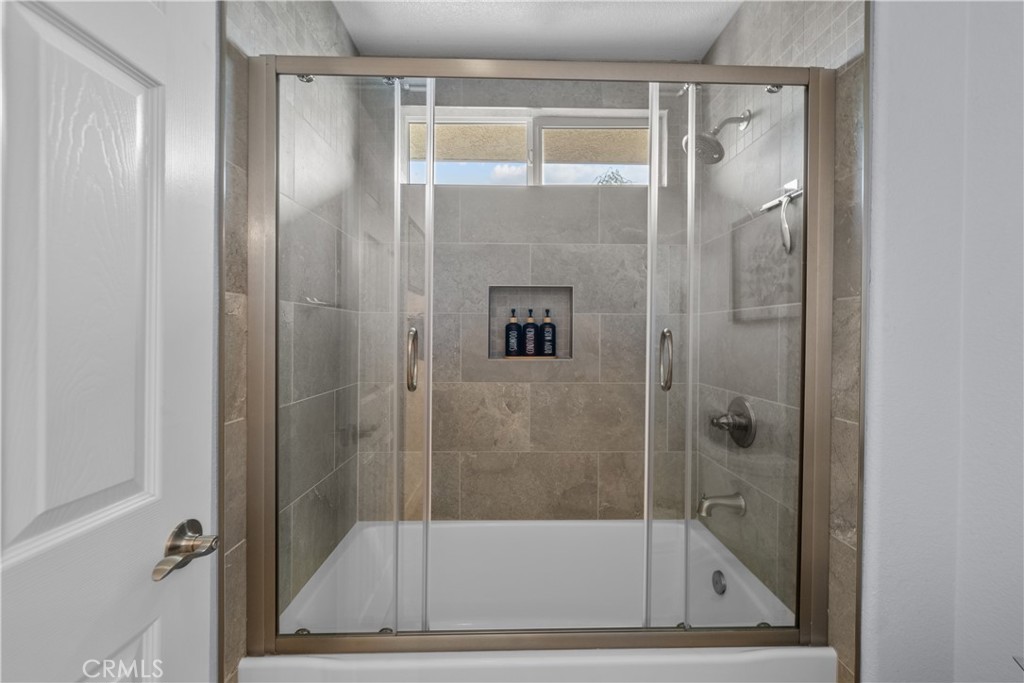 29350 Las Brisas Road Valencia, CA 91354 - Photo 40 of 75 a bathroom with a glass shower door