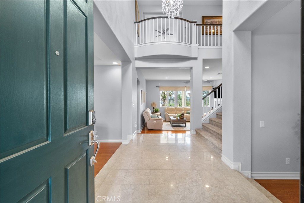 29350 Las Brisas Road Valencia, CA 91354 - Photo 4 of 75 a view of front door with dining room and stairs