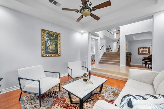 a livingroom with furniture and wooden floor