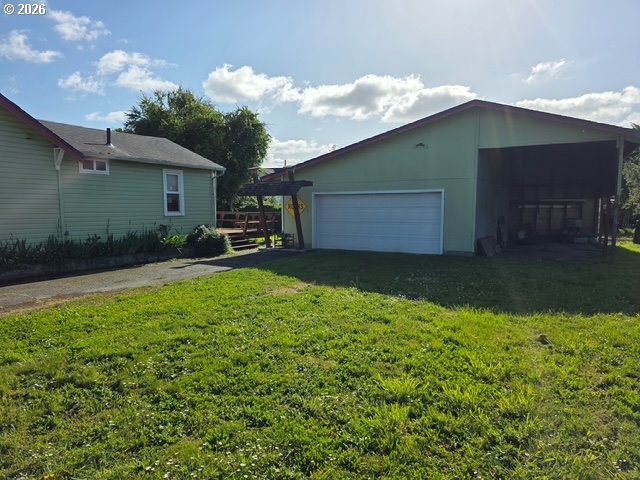 812 B Street Myrtle Point, OR 97458 - Photo 3 of 5 a backyard of a house with table and chairs