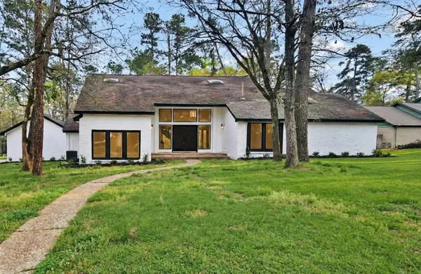 a view of a house with a back yard