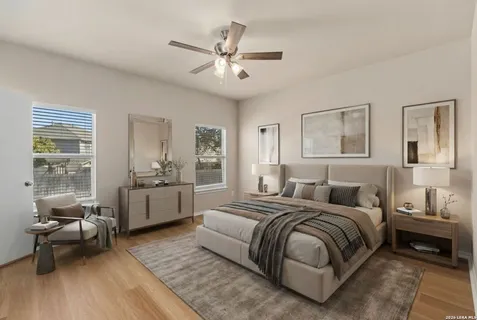 a spacious bedroom with a bed and a couch