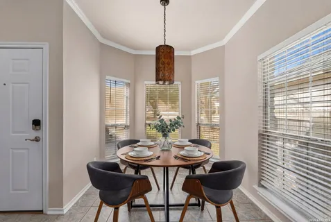 a view of a dining room with furniture window and outside view