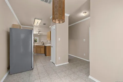 a view of a kitchen cabinets and refrigerator