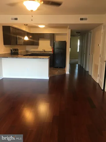 a view of a kitchen with a sink and a microwave