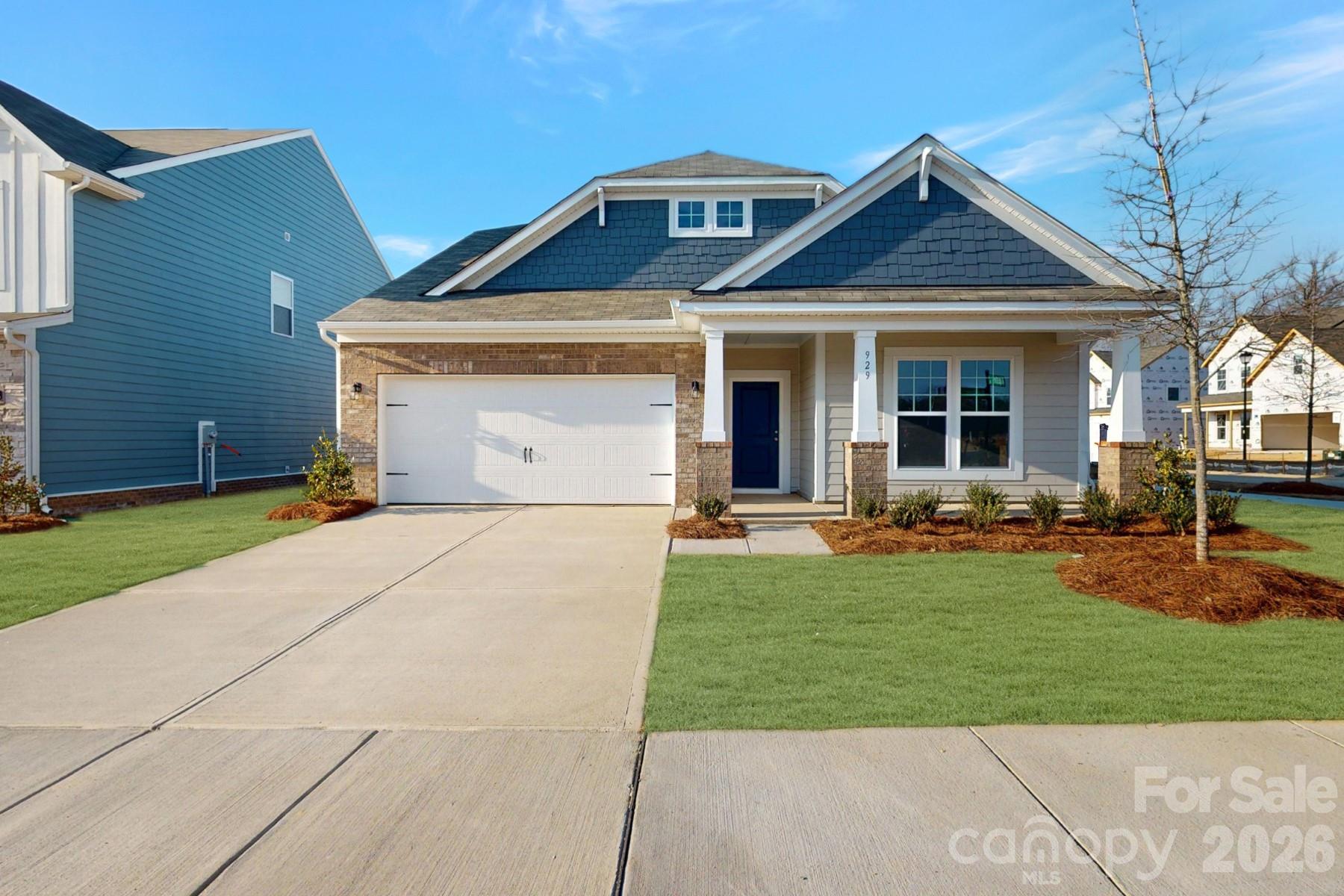 929 Barker Street Monroe, NC 28112 - Photo 1 of 26 a front view of a house with garden