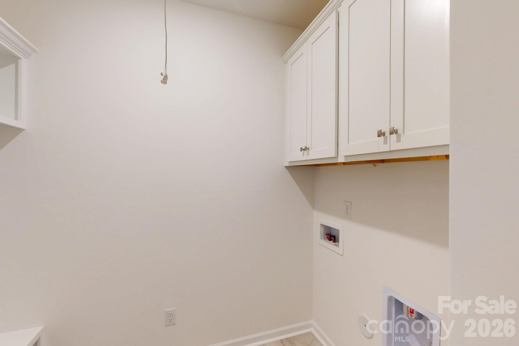 929 Barker Street Monroe, NC 28112 - Photo 16 of 26 a view of storage and utility room with racks on the wall