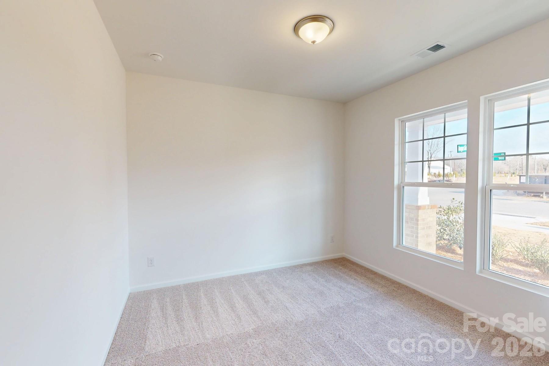 929 Barker Street Monroe, NC 28112 - Photo 17 of 26 an empty room with windows