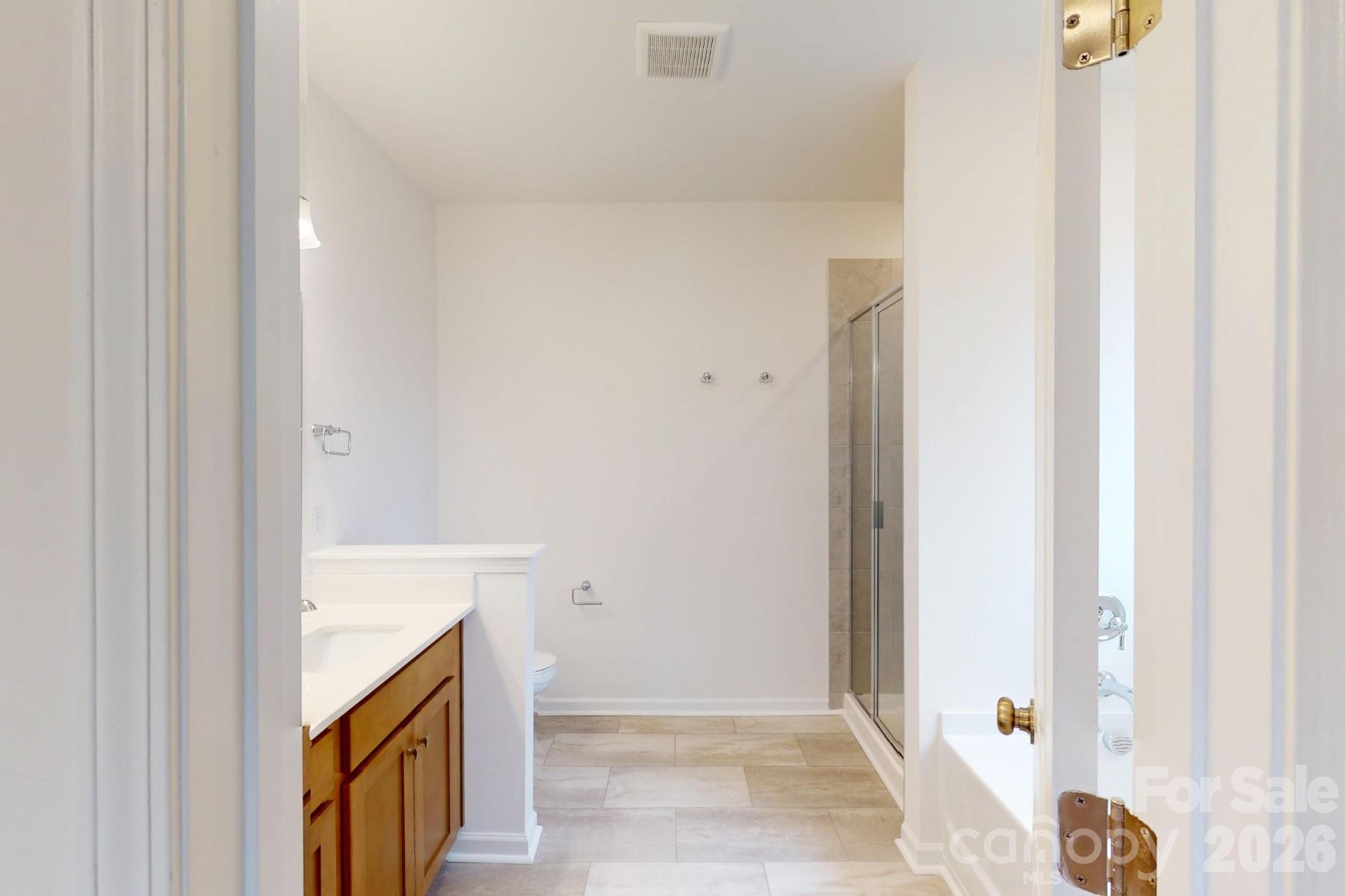 929 Barker Street Monroe, NC 28112 - Photo 23 of 26 a view of an entryway with wooden floor