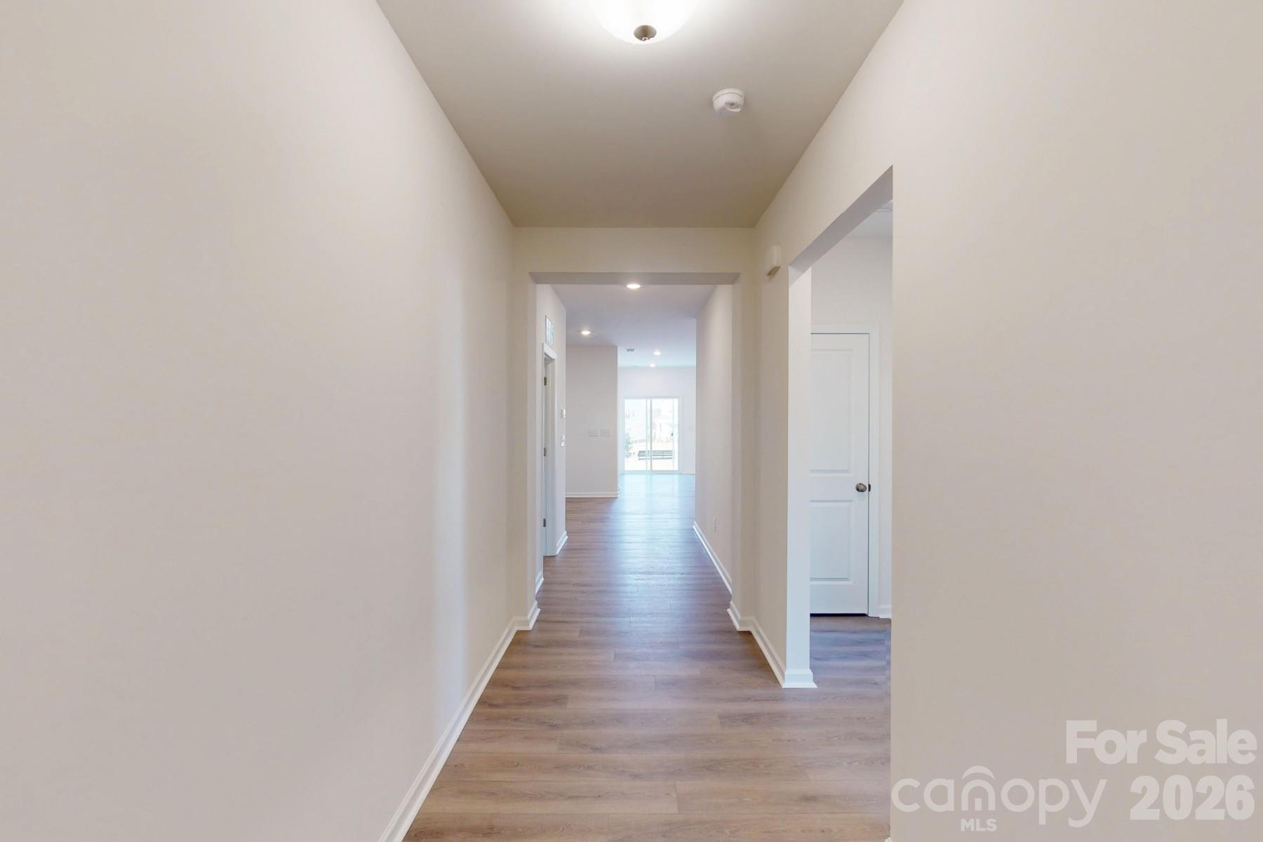 929 Barker Street Monroe, NC 28112 - Photo 3 of 26 a view of a hallway with wooden floor