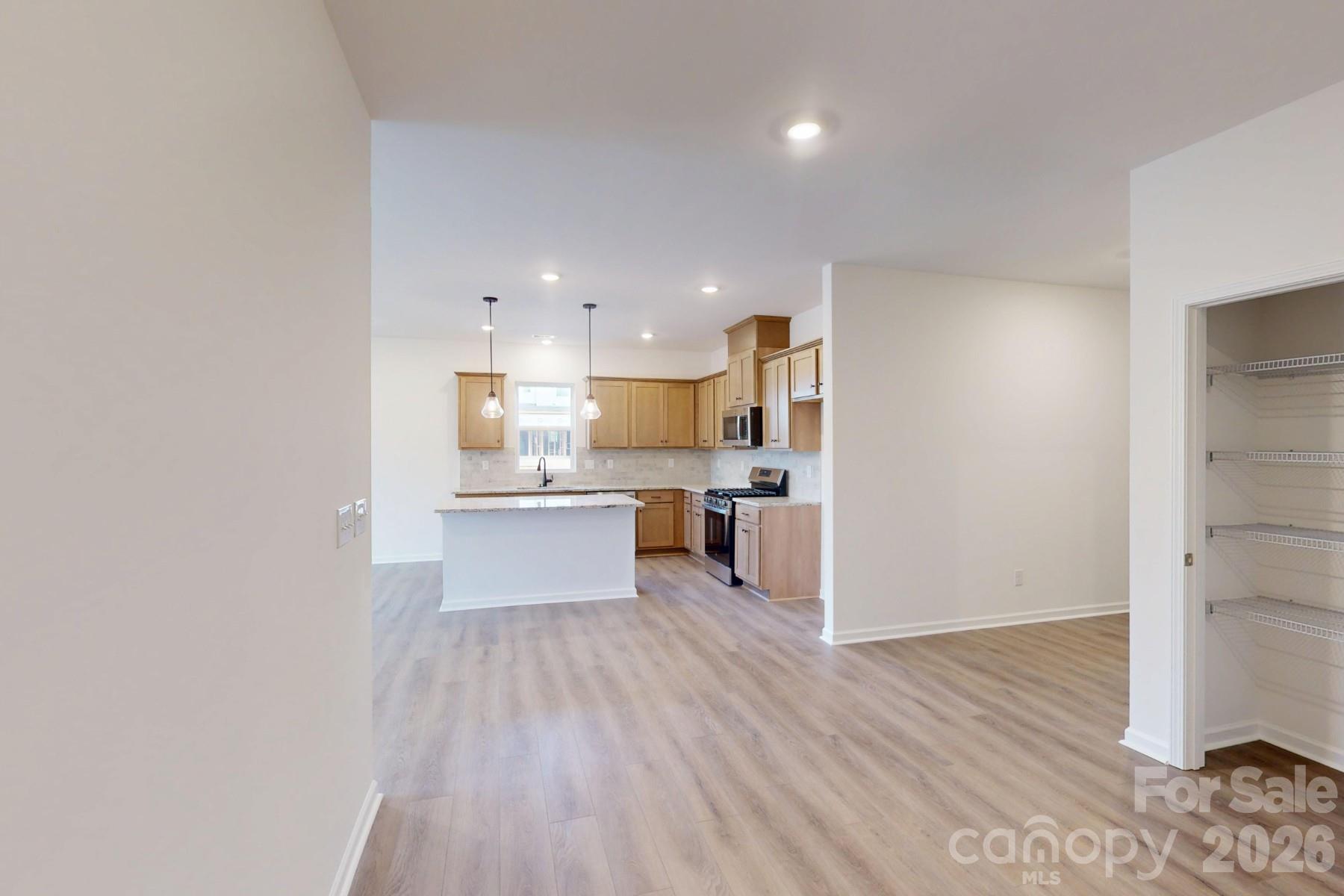 929 Barker Street Monroe, NC 28112 - Photo 9 of 26 a view of kitchen with wooden floor