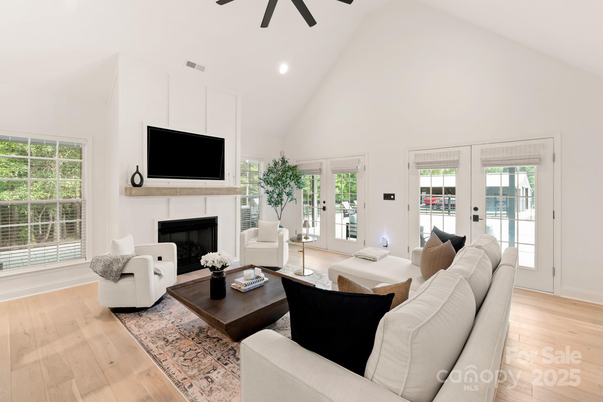 1046 Sutton Spring Road York, SC 29745 - Photo 18 of 48 a living room with furniture a fireplace and a flat screen tv