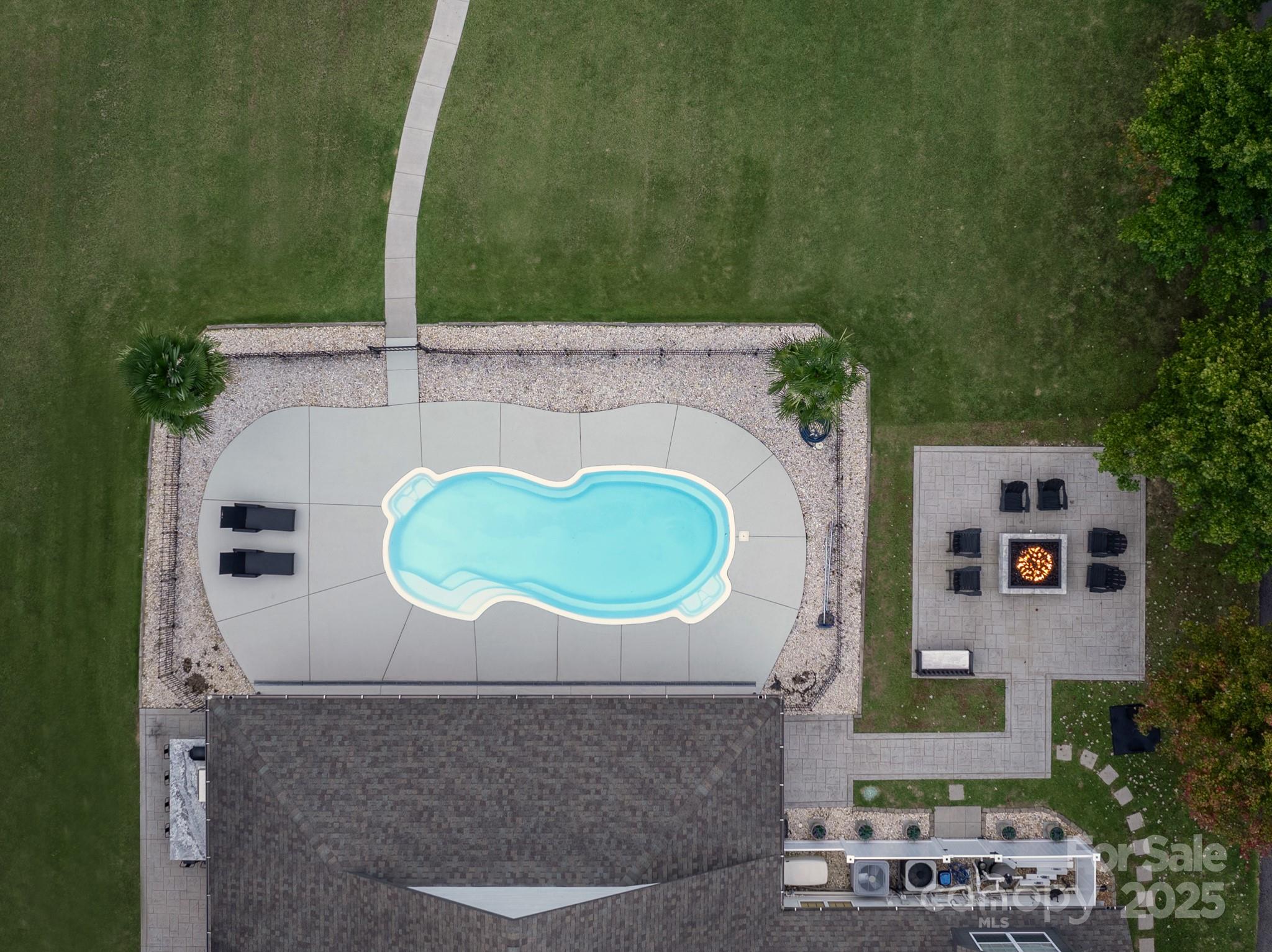 1046 Sutton Spring Road York, SC 29745 - Photo 44 of 48 a aerial view of a house with a swimming pool