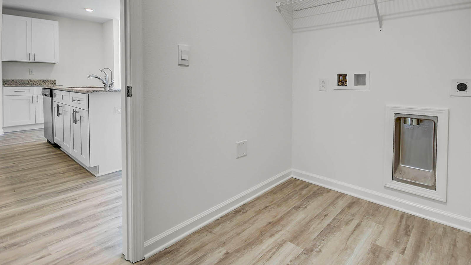 219 Gray Owl Drive Freeport, FL 32439 - Photo 21 of 22 a view of a kitchen with wooden floor and a sink