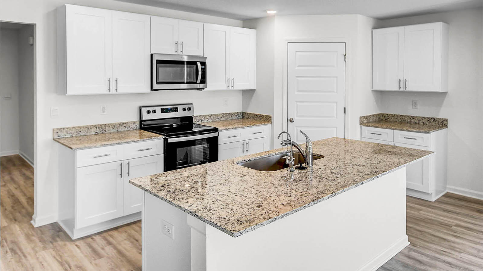 219 Gray Owl Drive Freeport, FL 32439 - Photo 7 of 22 a kitchen with a stove microwave and refrigerator