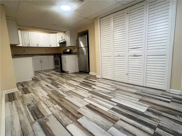 a view of a kitchen with a sink