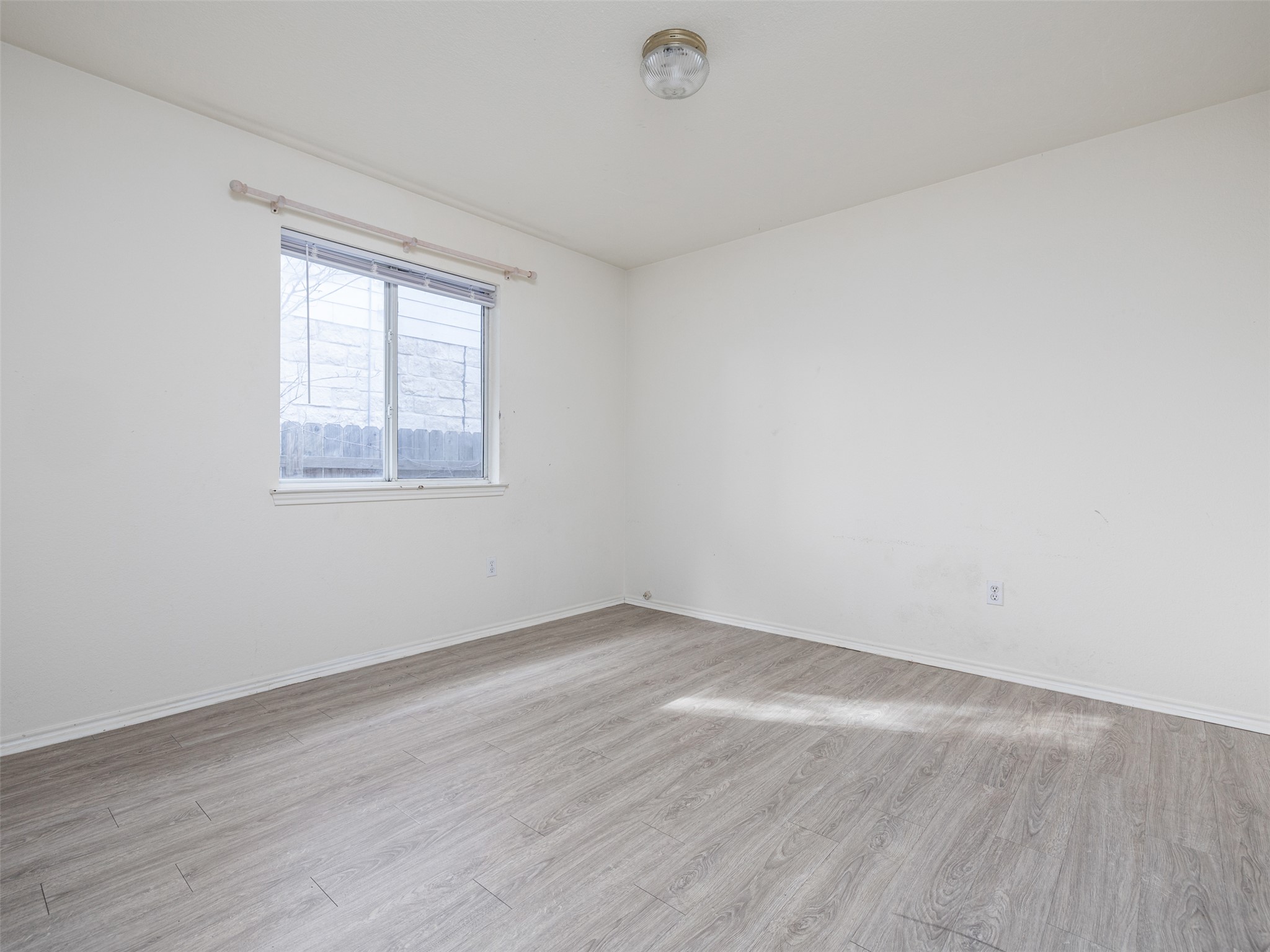 8537 Foxhound Trail Austin, TX 78729 - Photo 21 of 26 Unfurnished room featuring light wood-style floors