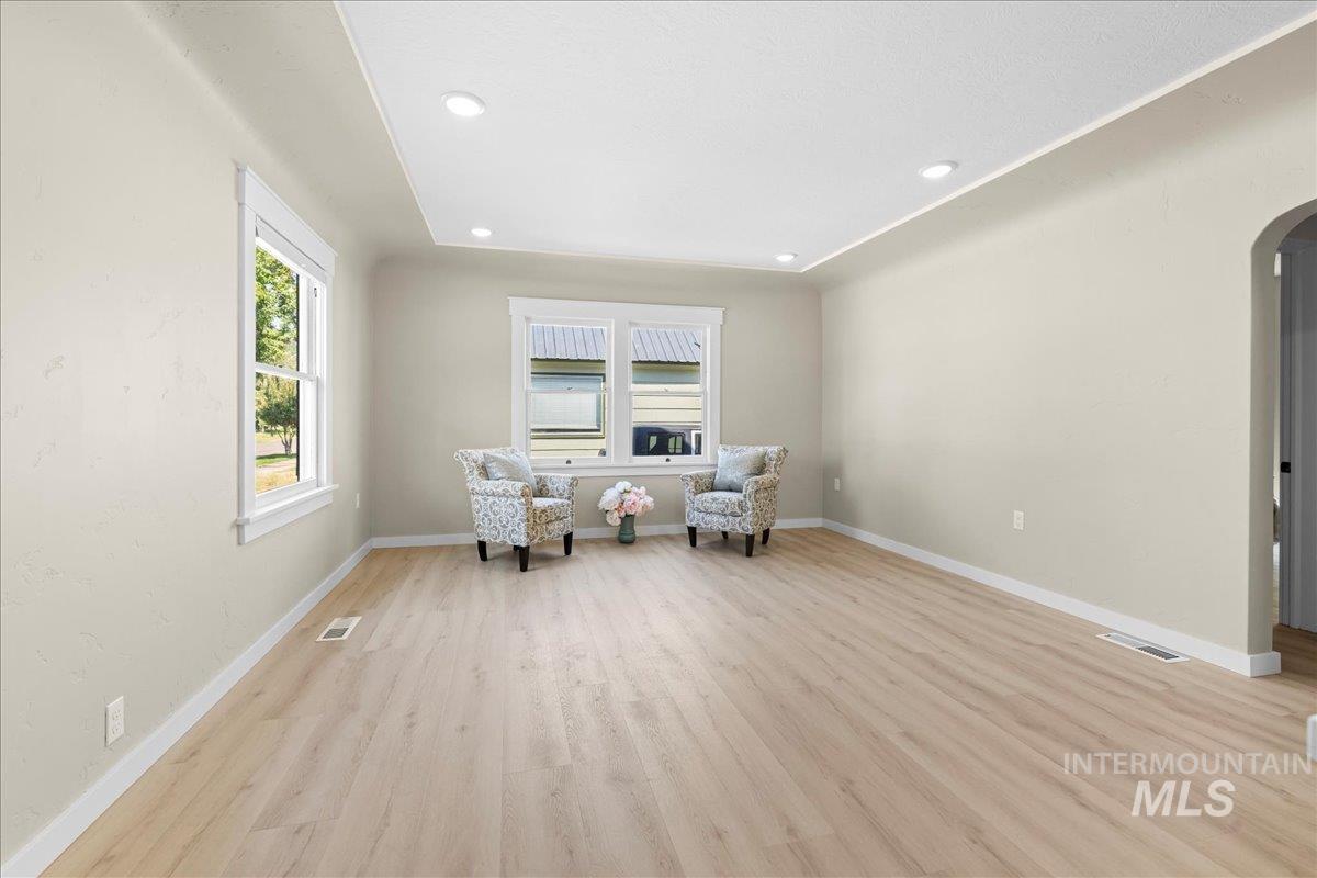 914 West 3rd Street Weiser, ID 83672 - Photo 11 of 49 Sitting room featuring arched walkways, light wood-style flooring, and recessed lighting