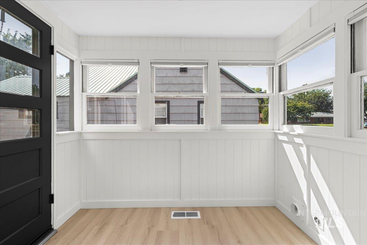914 West 3rd Street Weiser, ID 83672 - Photo 19 of 49 Entryway with wood finished floors and wooden walls