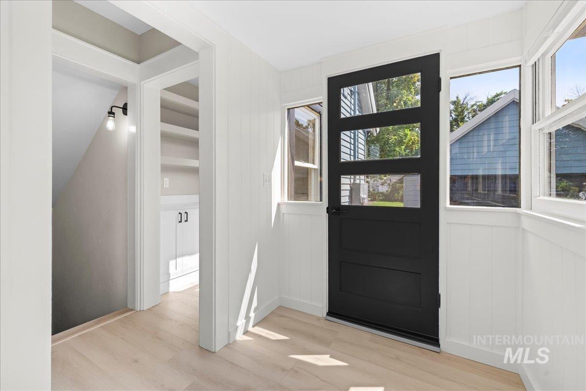 914 West 3rd Street Weiser, ID 83672 - Photo 20 of 49 Entryway featuring wood finished floors and wooden walls