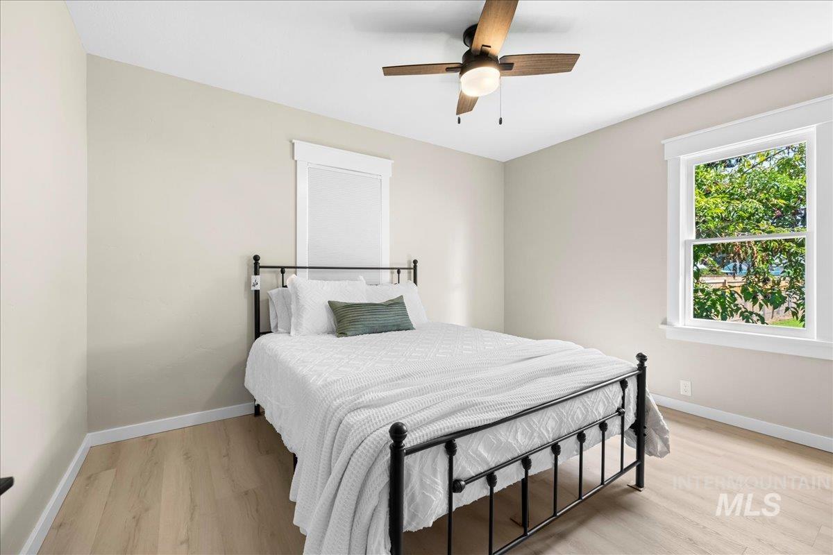 914 West 3rd Street Weiser, ID 83672 - Photo 22 of 49 Bedroom featuring light wood-style flooring and ceiling fan