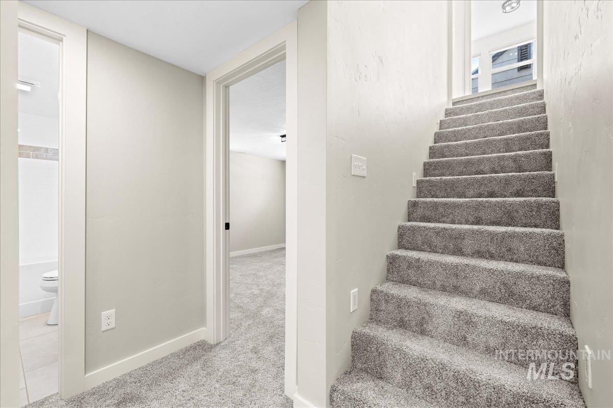914 West 3rd Street Weiser, ID 83672 - Photo 36 of 49 Staircase with carpet floors and baseboards