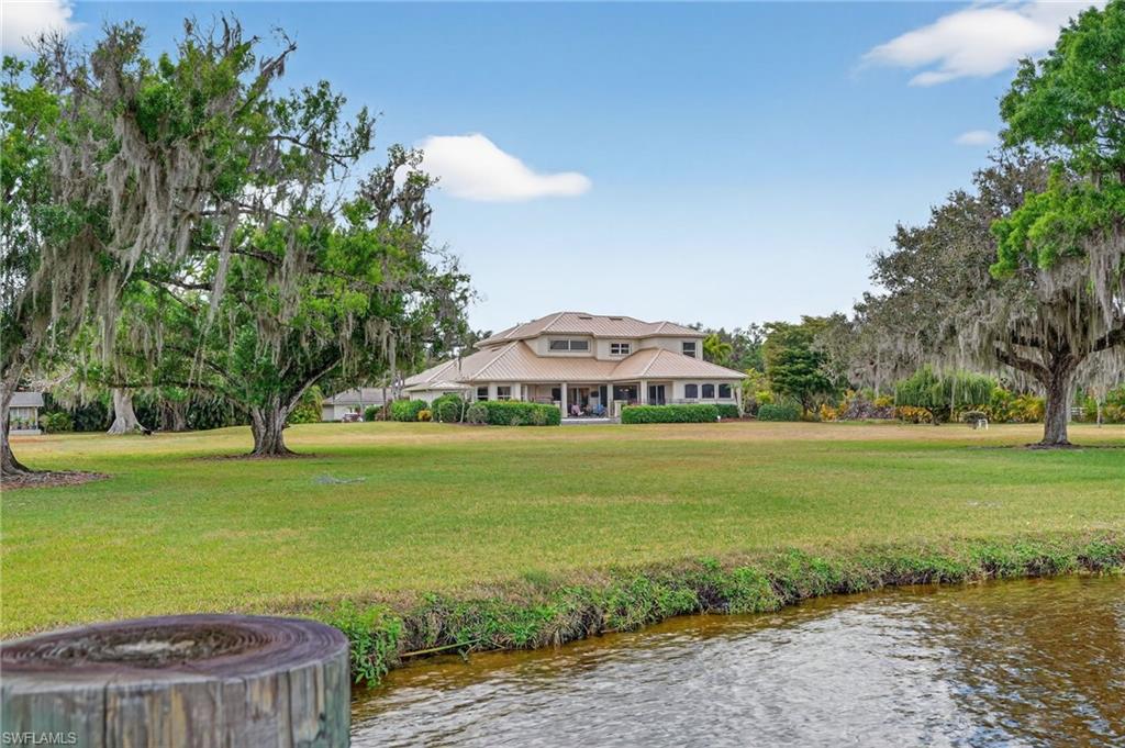 1964 Rialto Way Alva, FL 33920 - Photo 50 of 50 a view of a swimming pool with an outdoor space and seating area