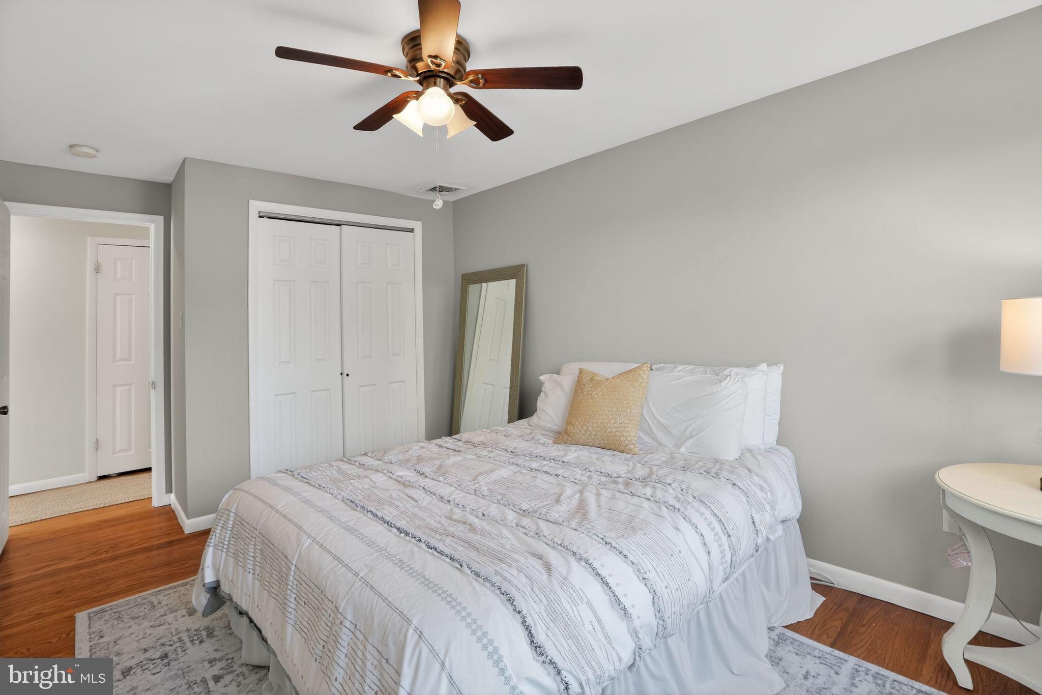962 Edwards Drive Springfield, PA 19064 - Photo 24 of 32 a bedroom with a bed and a chandelier