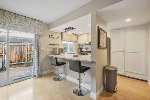 a kitchen with stainless steel appliances a sink and stove