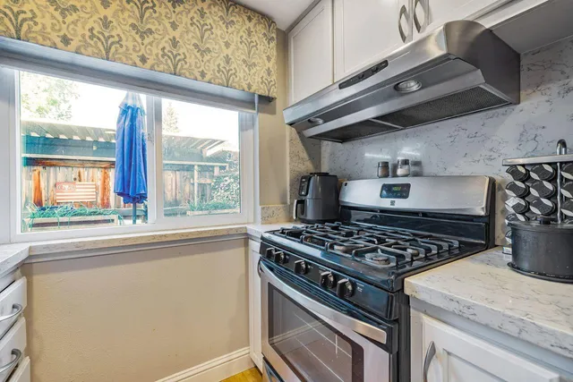 a view of a livingroom with furniture and a flat screen tv