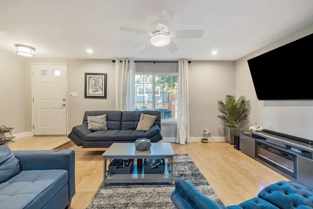 a living room with furniture and a rug