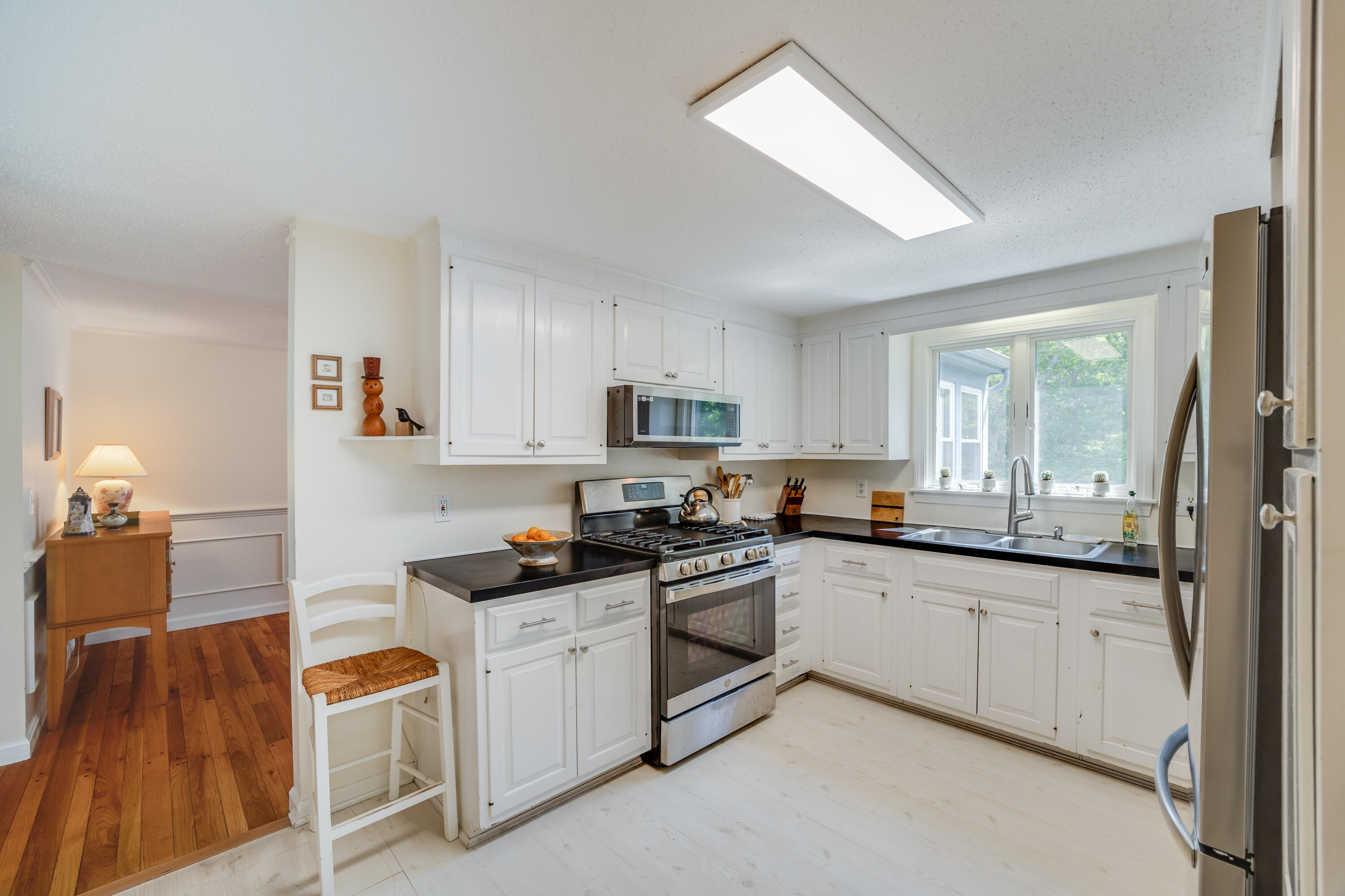 240 Braggs Lane Barnstable, MA 02630 - Photo 16 of 54 a kitchen with white cabinets appliances and sink