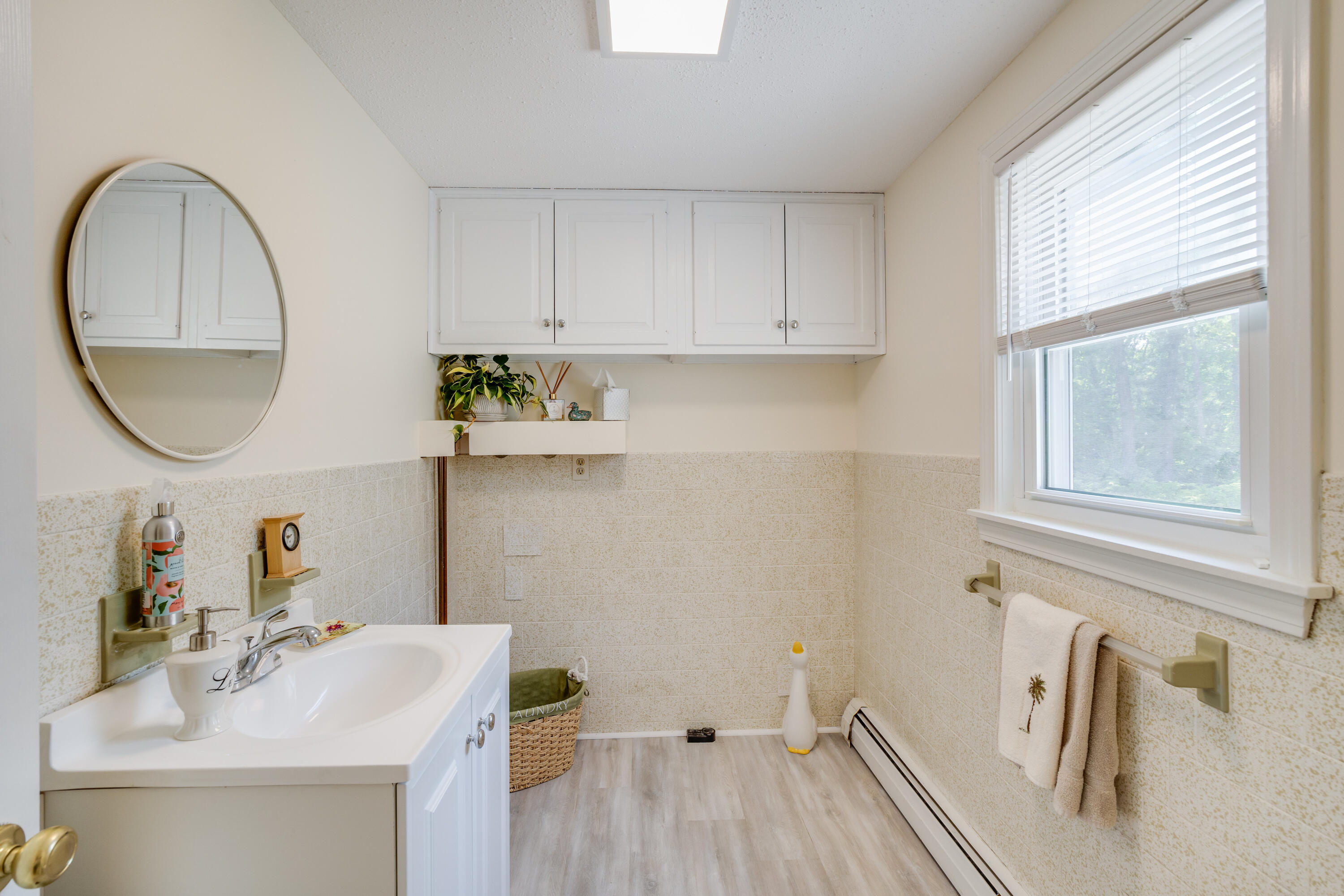 240 Braggs Lane Barnstable, MA 02630 - Photo 19 of 54 a bathroom with a sink and a mirror