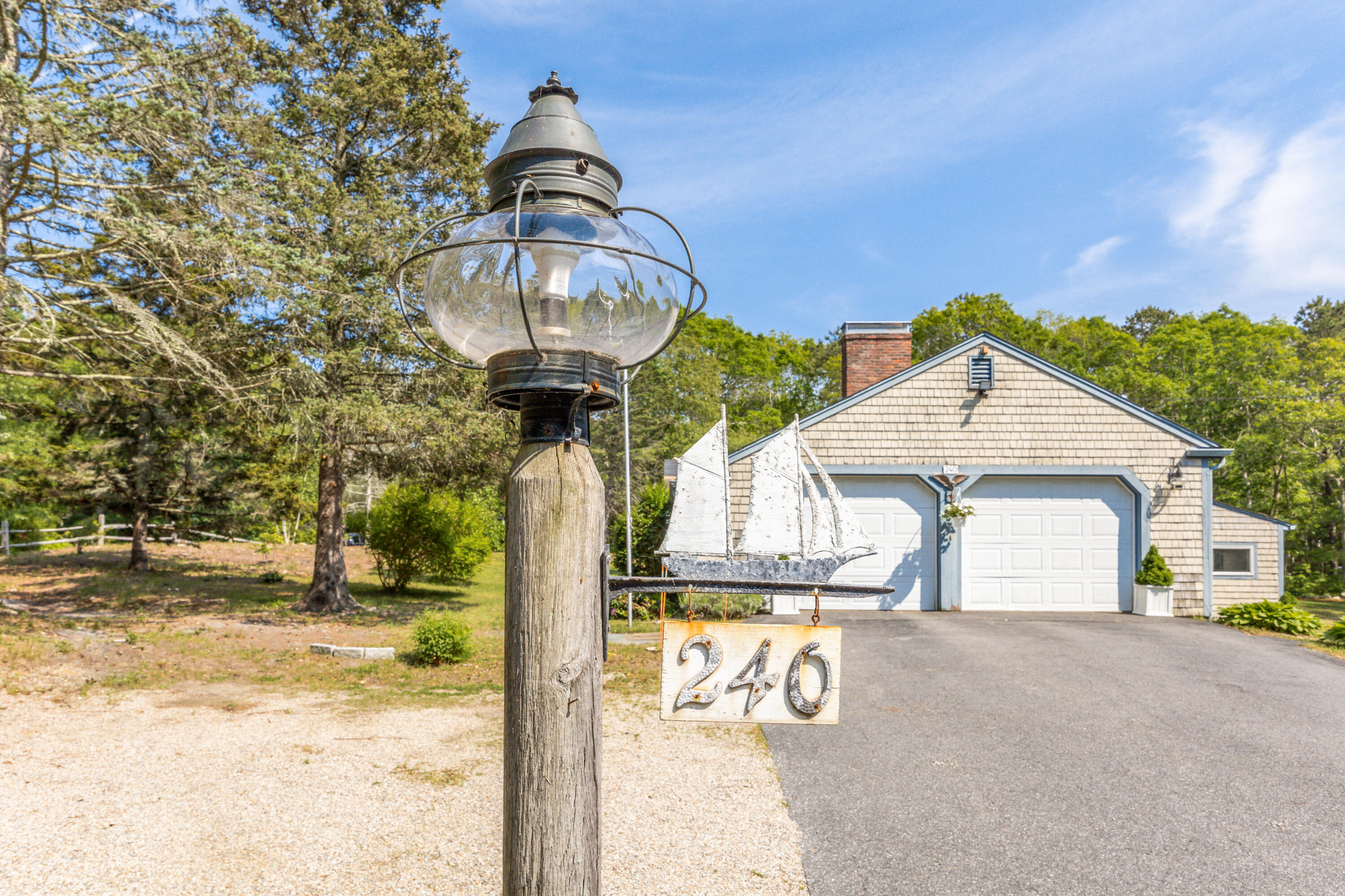 240 Braggs Lane Barnstable, MA 02630 - Photo 2 of 54 a front view of a house with garden