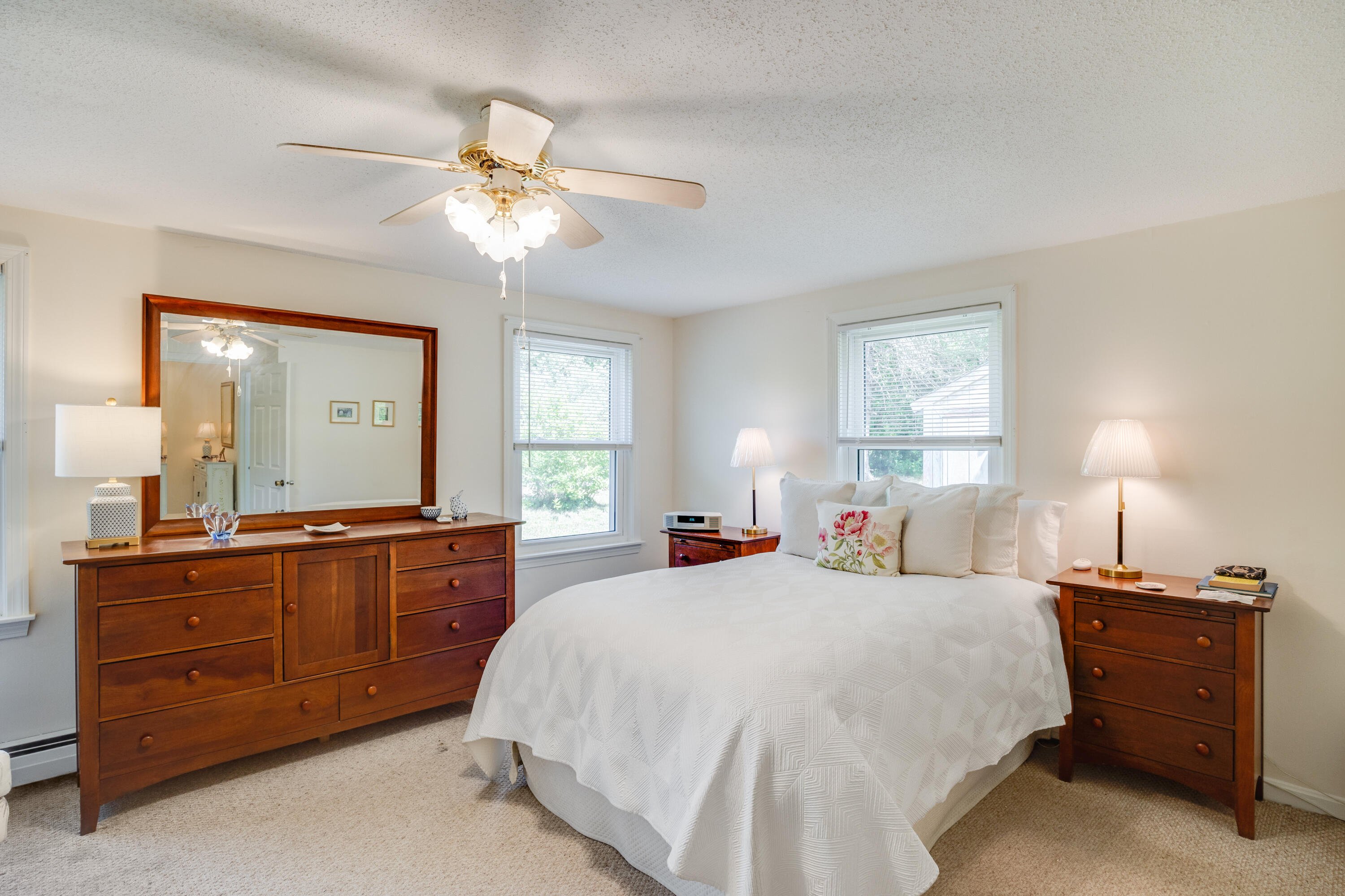 240 Braggs Lane Barnstable, MA 02630 - Photo 23 of 54 a bedroom with a bed and a dresser