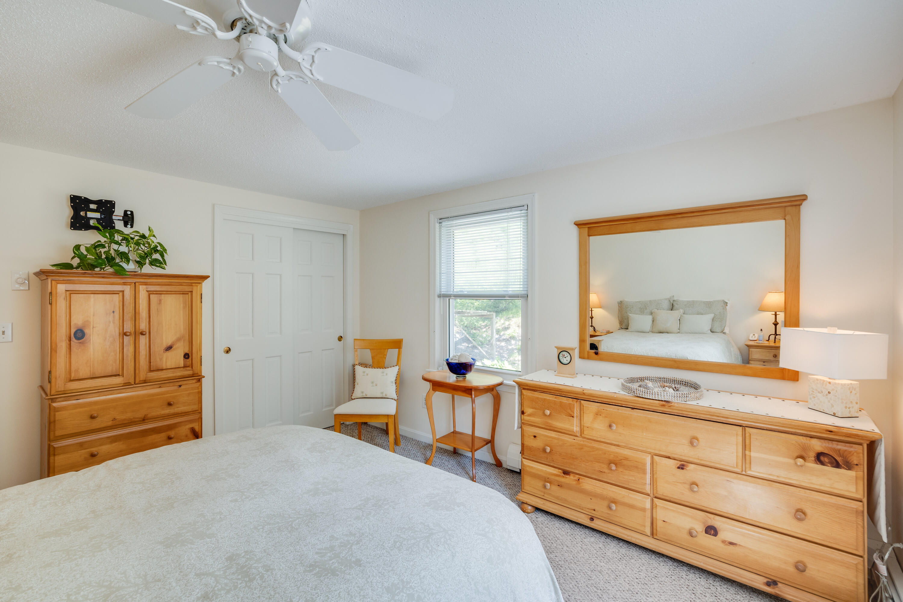 240 Braggs Lane Barnstable, MA 02630 - Photo 27 of 54 a bedroom with a bed and large windows
